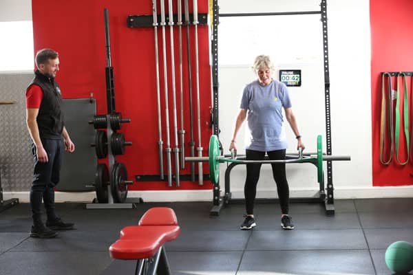 Woman with personal trainer