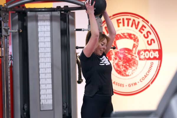 Woman using medicine ball