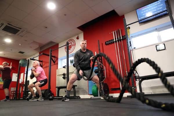 Men using battleropes